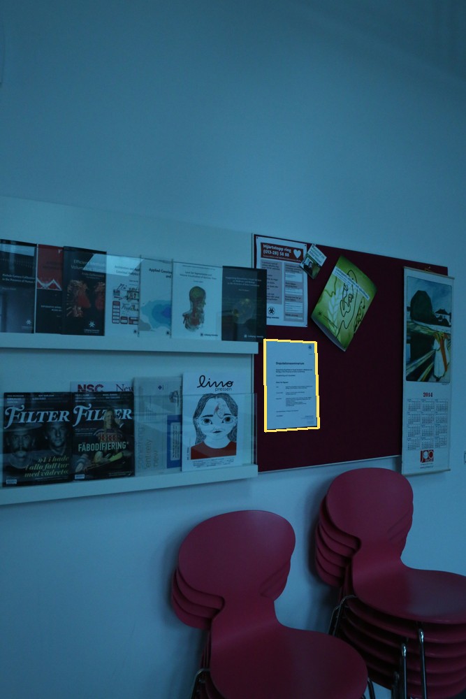 Lunch-room photograph with paper notice outlined in yellow